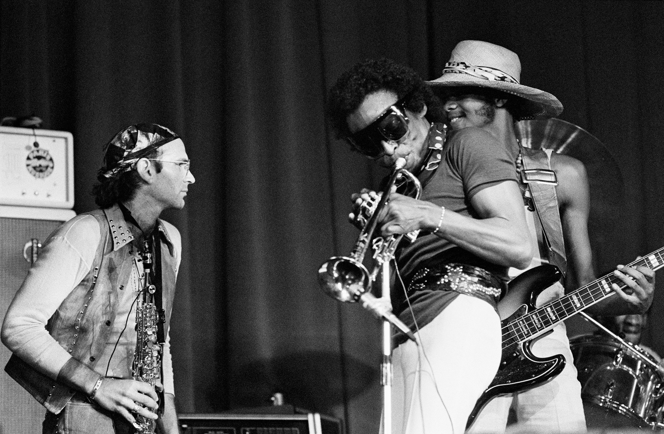 Dave Liebman on soprano sax, Miles on trumpet, and Michael Henderson on bass onstage at Olympia Hall in Paris, circa 1973. Photo by Alain Dejean/Sygma via Getty Images.